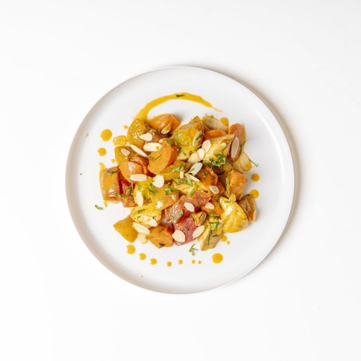 Roasted root vegetables with harissa and toasted almonds - Price varies with selection
